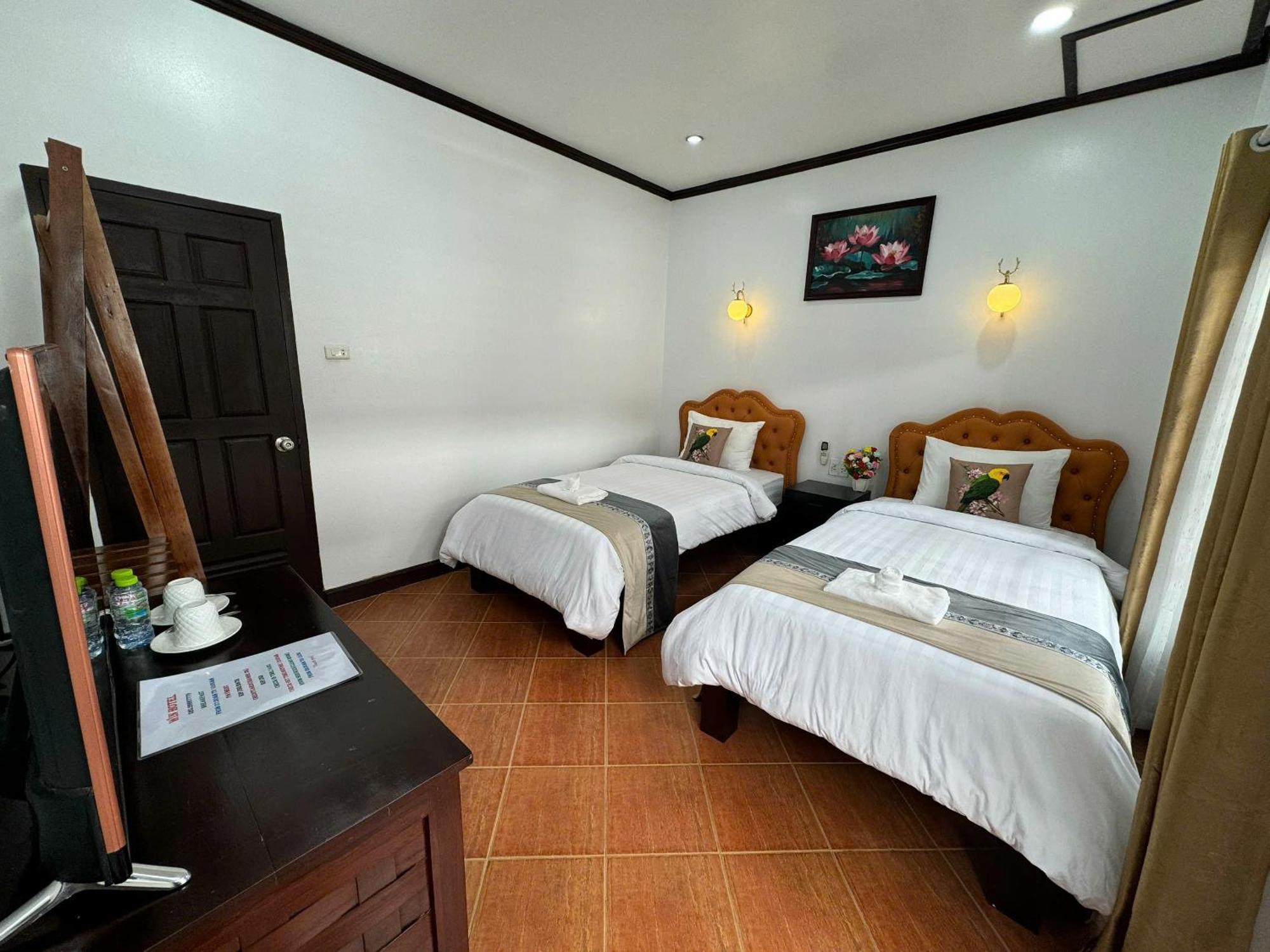 Win Hotel Vang Vieng Quarto foto